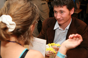 Two people conversing over a menu