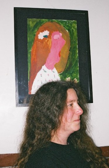 Photo of Athene Reiss underneath her portrait
